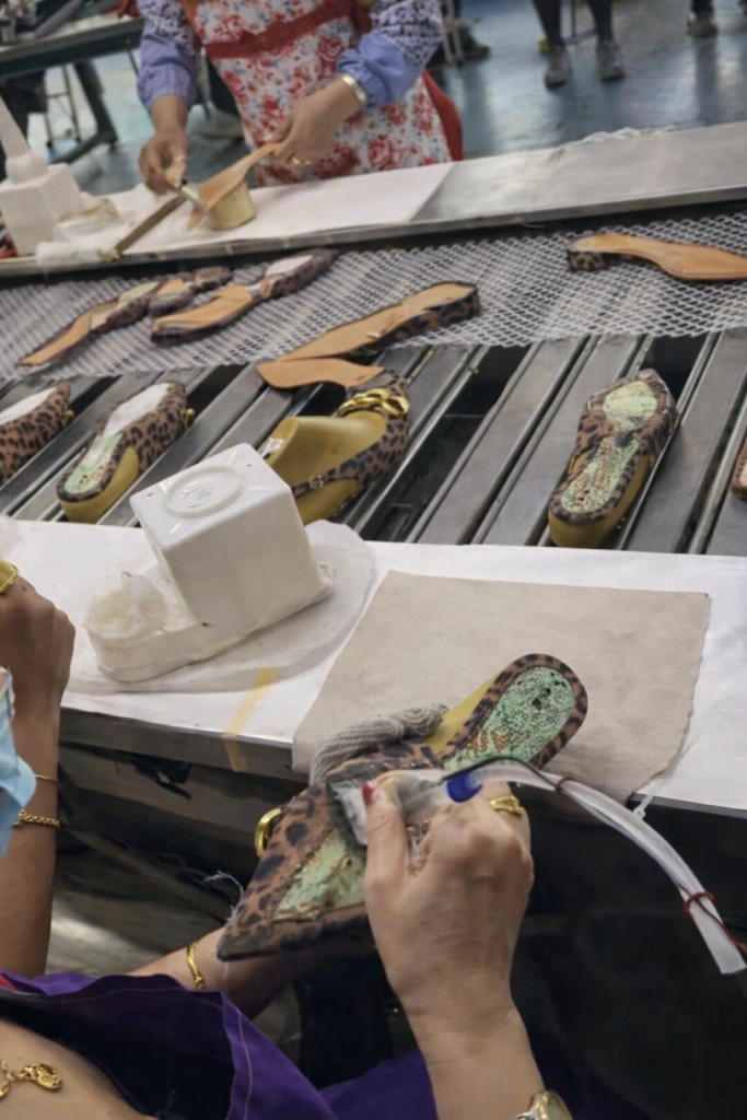 Primary adhesive coating in footwear manufacturing