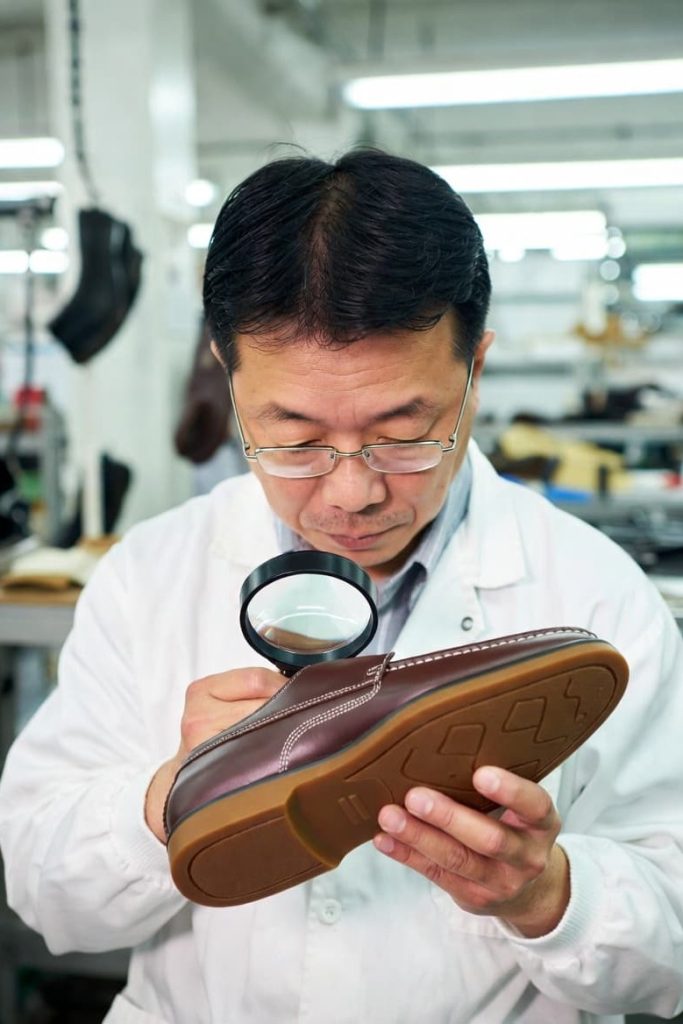 Footwear quality inspection during Final AQL Audit.