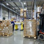 Carton packing and palletization in footwear manufacturing