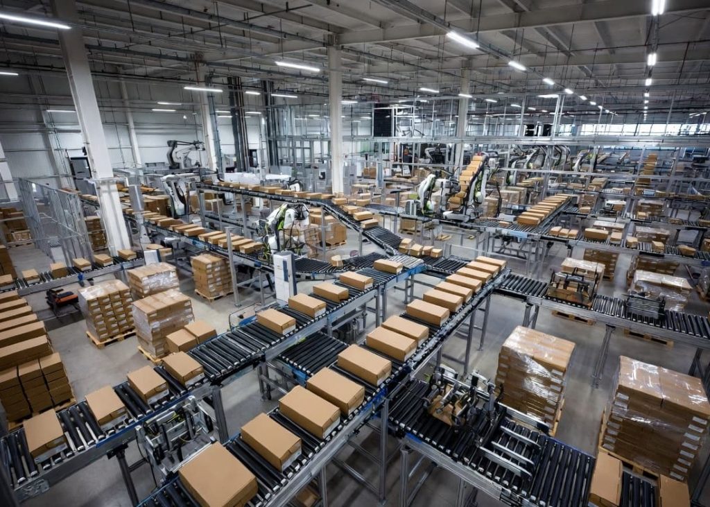 Automated robotic fulfillment center handling footwear product inventory and shipments.